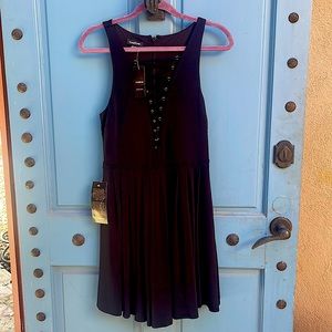 Gorgeous NWT Bebe black cocktail dress. Size medium. Lace front zip back.